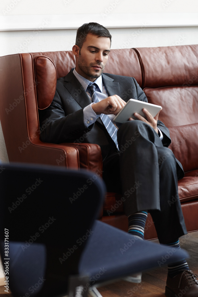 Canvas Prints Businessman, reading and tablet on couch for online, research and email in waiting room. Trader, stock market and internet with technology for planning and proposal for international company