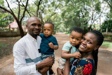 Portrait of an african family smiling in a residential street