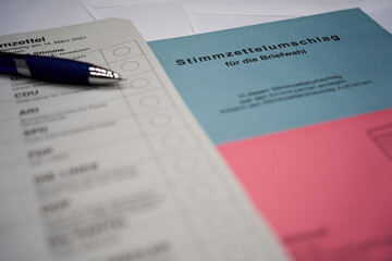German voting ballot with a blue pen. ( translation of german word Briefwahl: Postal vote )....