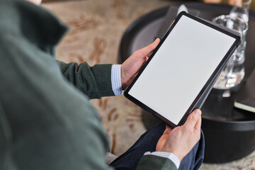 Male expert holding tablet with chroma key in his hands
