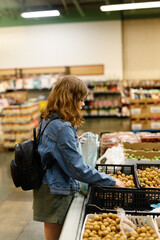 Young girl shopping for lychee