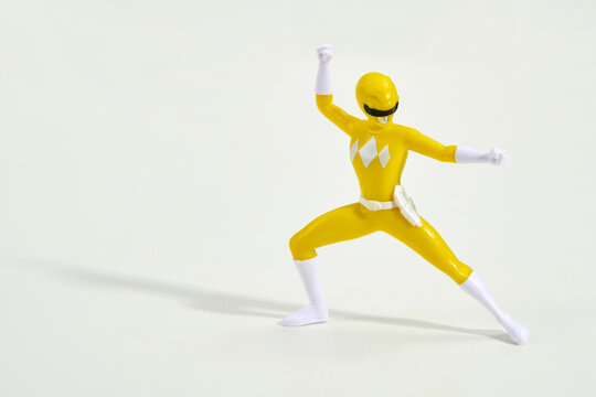 Famous cartoon character Power Ranger in yellow suit
