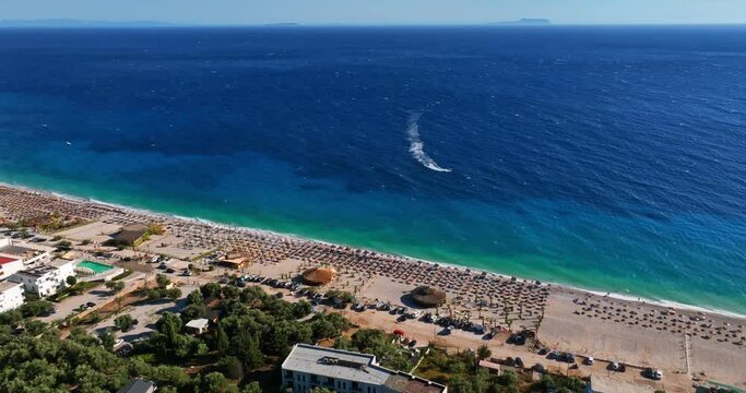 Aerial: Perivolos beach on the Albanska riviera, sunny day in Dhermi, Albania
