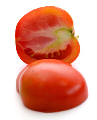 Fresh red ripe tomatoes against white background - stock photo
