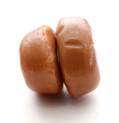 milk caramel candies isolated on white
