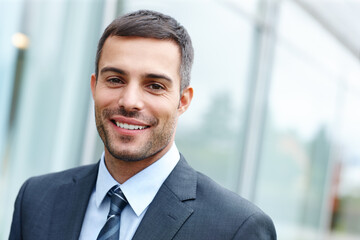 Fototapeta premium Outdoor, man and happy on portrait as lawyer for career or job growth and opportunity with startup business. Male employee, smile and satisfied for law firm progress as attorney or legal advisor