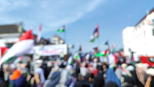 Blurry video of demonstrations supporting Palestinian independence and denouncing Israeli genocide