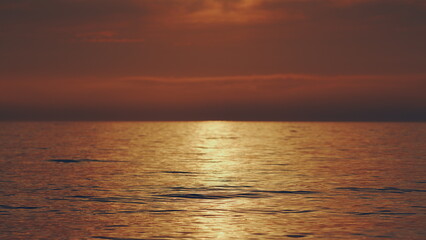 Reflection Of Sunlight Over Lake Surface. Sea Water Surface At Sunset. Water Is Rippling.
