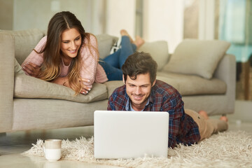 Home, happy couple and laptop on carpet in living room for streaming movie, online series and comedy. Bonding, connection and people with computer for entertainment, relax and digital show in lounge