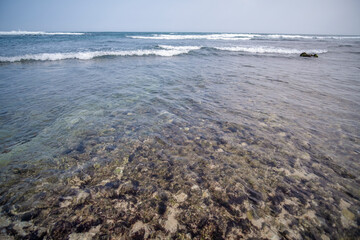 Sea waves on coral rocks.