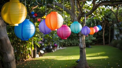 Fototapeta premium A garden wedding with rainbowcolored lanterns hanging from trees, leaving ample copy space in the garden area