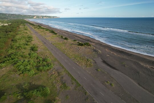aerial view of the runway at the edge of the gray sandy beach. natural background