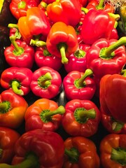 Red juicy bell peppers, capisums background