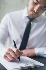 Businessman, report and writing document for signature of legal contract, agreement or deal for...