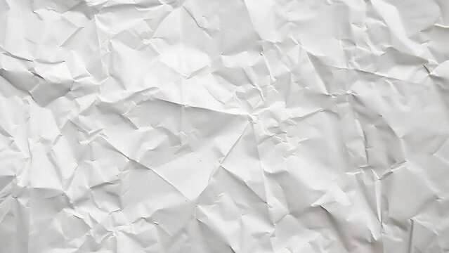 White crumpled sheet of paper texture stop motion seamless loop.