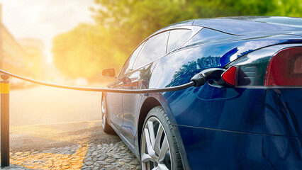 Modern Electric Car Charging in Charging Station Outdoors