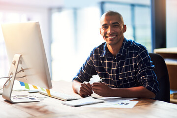 Portrait, smile and business man on computer in creative startup office for career or job in...