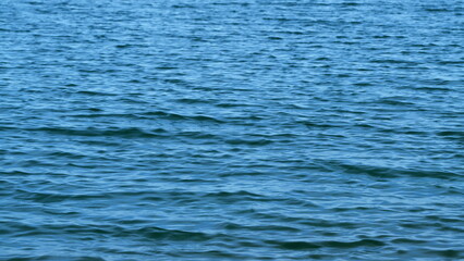 Sea And Water Surface. Texture Of Sea. Light Reflected On Water Surface. Close up.