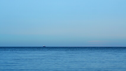 Obraz premium Calm Sea Horizon Background. Calm Blue Ocean Beach Water With Clear Blue Sky. Real time.