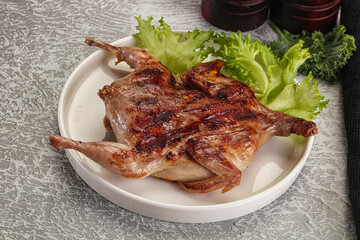 Grilled quail in the plate