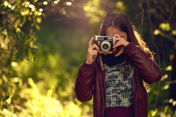 Vintage camera, nature and girl in park, photography and memory with picture, weekend break and...