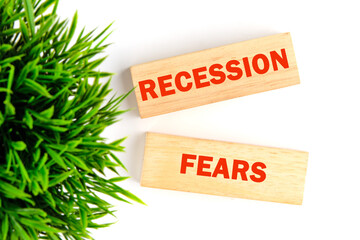 Recession fears symbol. Concept words RECESSION FEARS on wooden blocks on a white background with a...