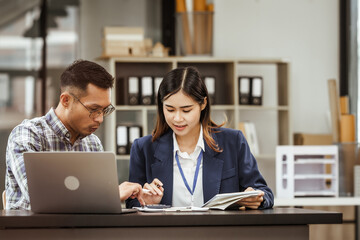 A middle-aged businessman, a young businesswoman, and Asian individuals are collaborating at desks. They engage in teamwork while managing commodities, trade, finance, and talent acquisition.