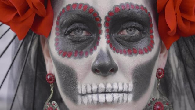 Portrait of a Woman in the guise of Holy Death who looks into your soul. Celebrating the Day of the Dead. Macro