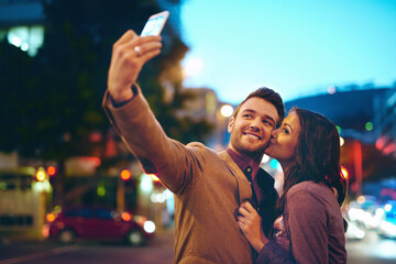 Couple, selfie and city with love at night with smartphone, outside and honeymoon for marriage....