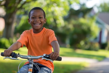 Fototapeta premium Happy boy enjoying a joyful childhood bike ride in the sunny. Suburban neighborhood. Experiencing the freedom and happiness of outdoor leisure activity and healthy lifestyle