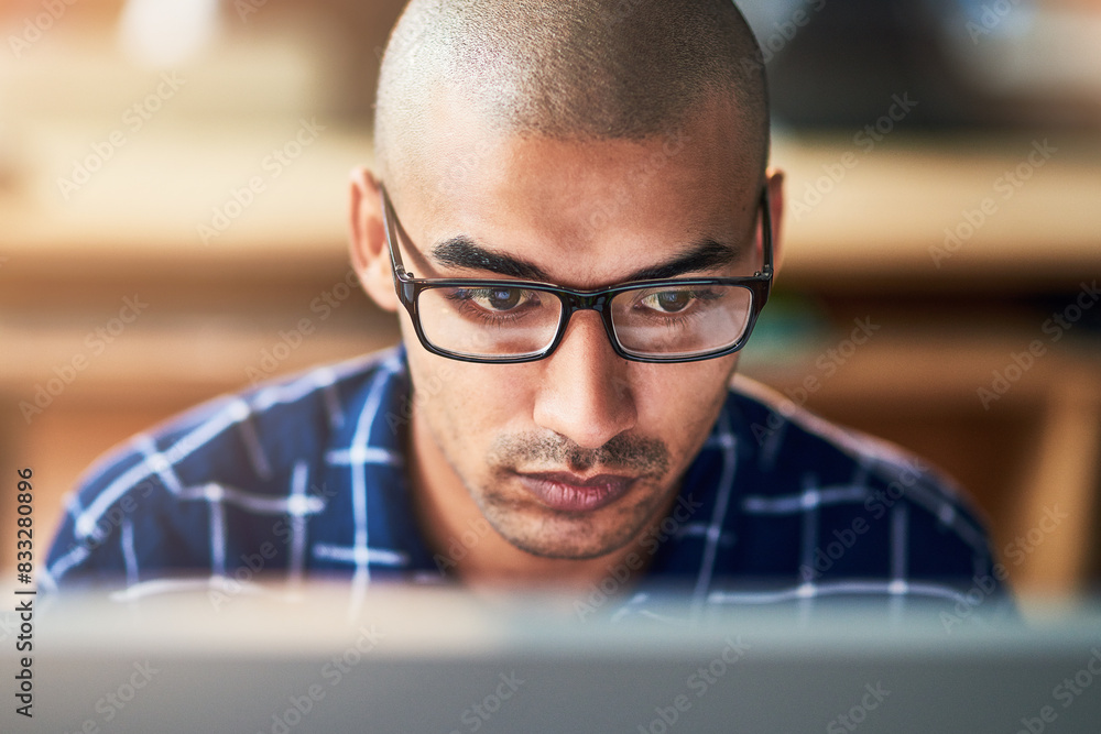 Fototapete Business man, reading and glasses on computer for software solution, research or problem solving. Programmer or developer with serious face for cloud computing, upgrade or security threats on website