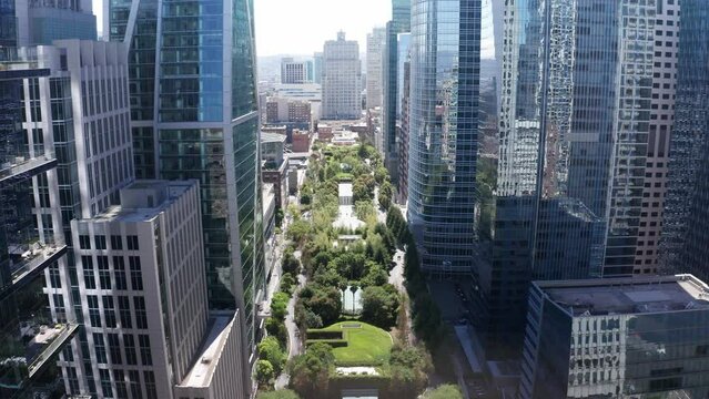 Aerial descending close-up shot of the urban green Salesforce Park on the roof of the Transbay Transit Center in downtown San Francisco, California. 4K