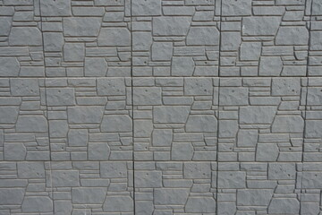 Backdrop - dark gray concrete brick veneer wall with random layout