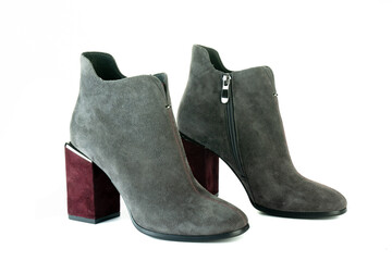 Women's red shoes from a varnish on a white background