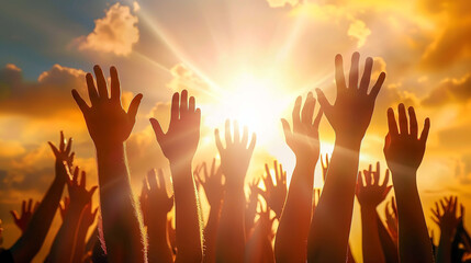 The sun's rays shining brightly behind the raised hands create a powerful sense