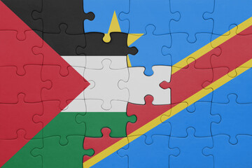 puzzle with the colourful national flag of democratic republic of the congo and flag of palestine.