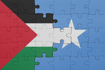 Fototapeta premium puzzle with the colourful national flag of somalia and flag of palestine.