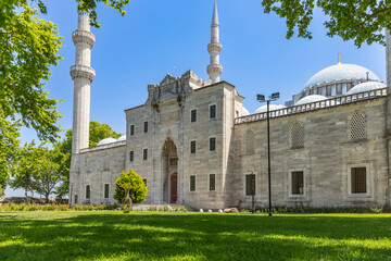 The magnificent view of the main entrance gate of the historical Süleymaniye Mosque, where the...