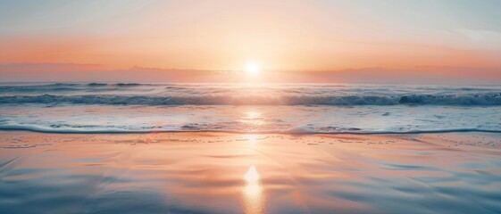 Peaceful ocean waves crashing on the shore at sunrise.