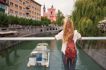 Female tourist visiting Ljubljana city, capital of Slovenia in Europ