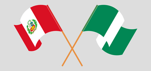 Crossed and waving flags of Peru and Nigeria