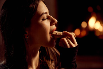 Sexy girl with red lips eats cookies