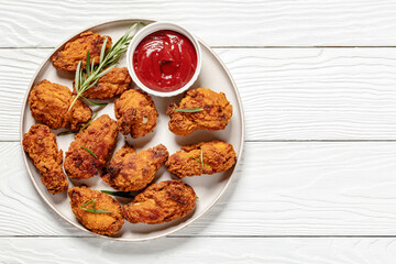 american style fried chicken wings on a plate