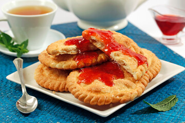 Anise pastries with berries jam.