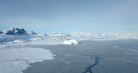 Antarctica majestic landscape drone view. Cold winter landscape of frozen ocean and towering...