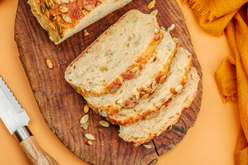 Fresh bread with pumpkin seeds. Home baking concept. Autumn decor