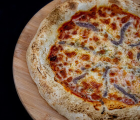 Traditional alicci or anchovy pizza, isolated in selective focus