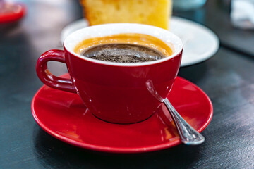 Black Americano Coffee and Lemon Cake on Side