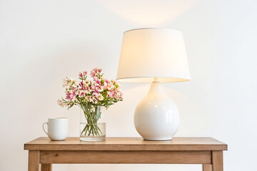 White Table Lamp With Pink Flowers and Coffee Cup