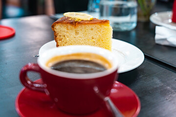 Black Americano Coffee and Lemon Cake on Side